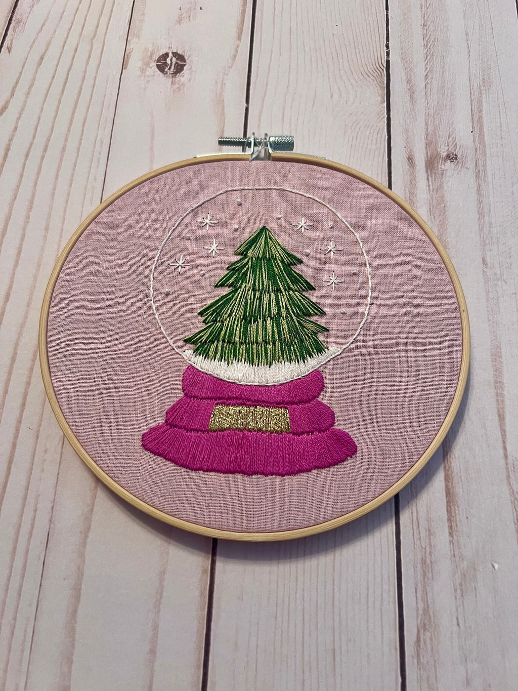 Christmas Tree Snow Globe Finished Embroidery Hoop on Pink Fabric