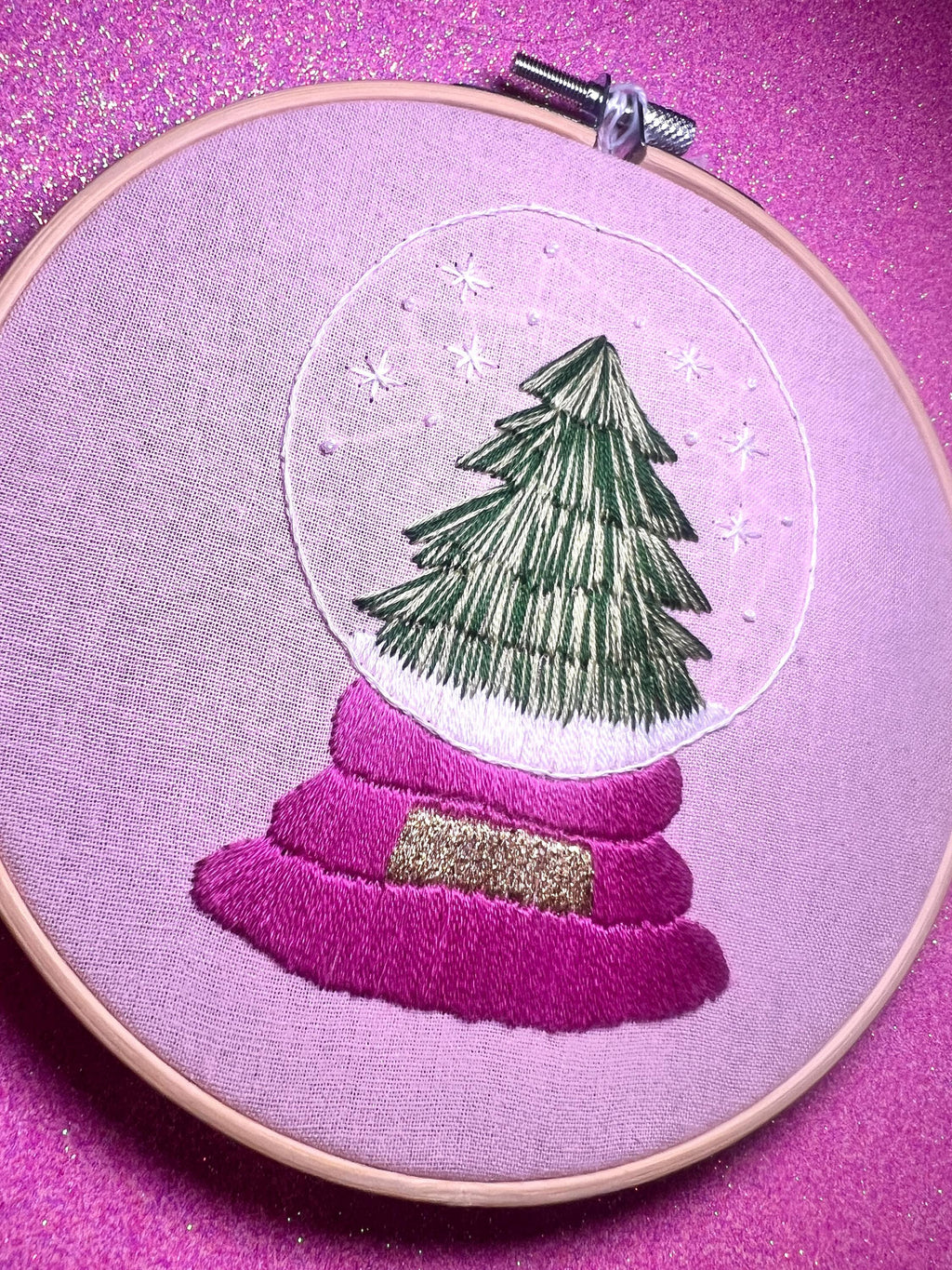 Christmas Tree Snow Globe Finished Embroidery Hoop on Pink Fabric