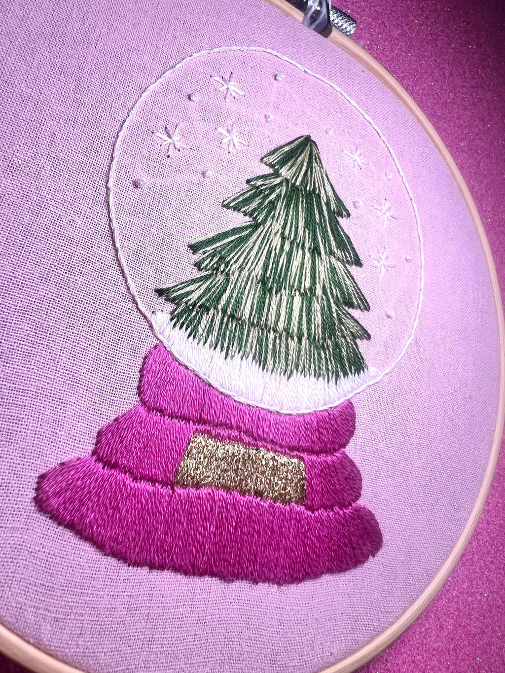 Christmas Tree Snow Globe Finished Embroidery Hoop on Pink Fabric