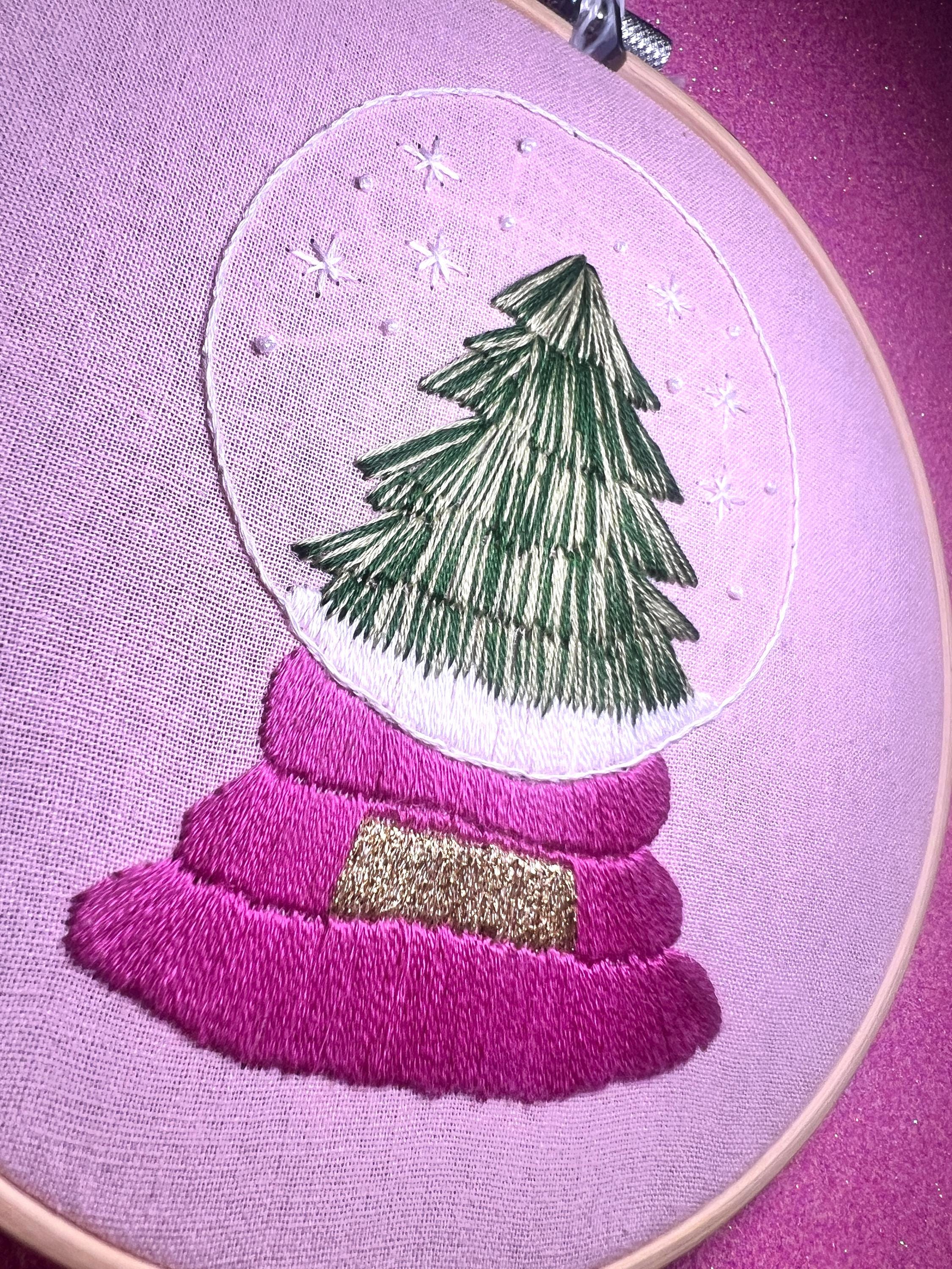 Christmas Tree Snow Globe Finished Embroidery Hoop on Pink Fabric