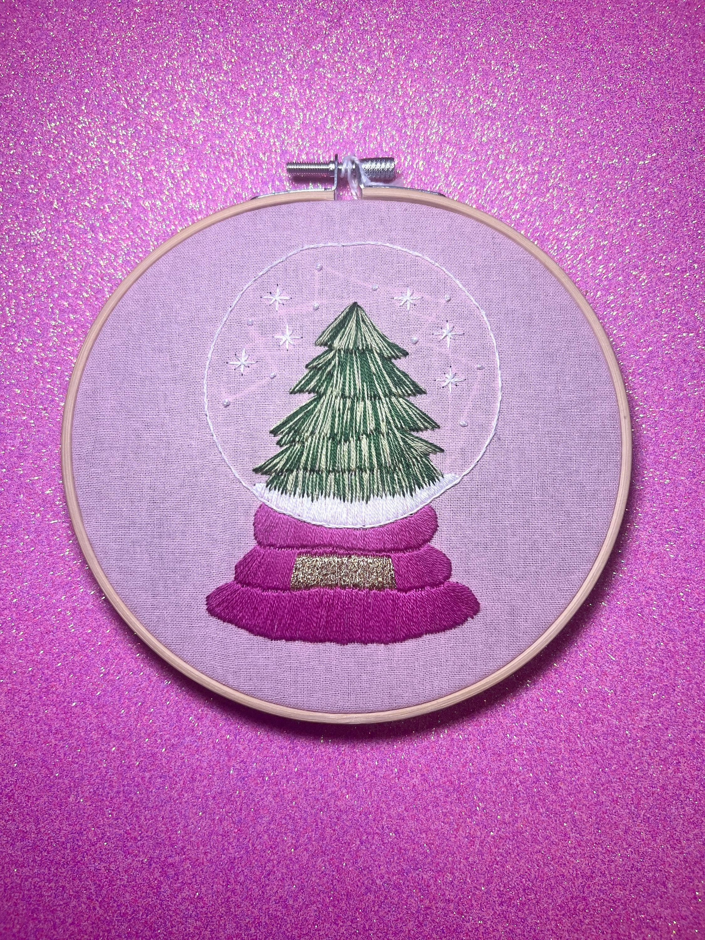Christmas Tree Snow Globe Finished Embroidery Hoop on Pink Fabric