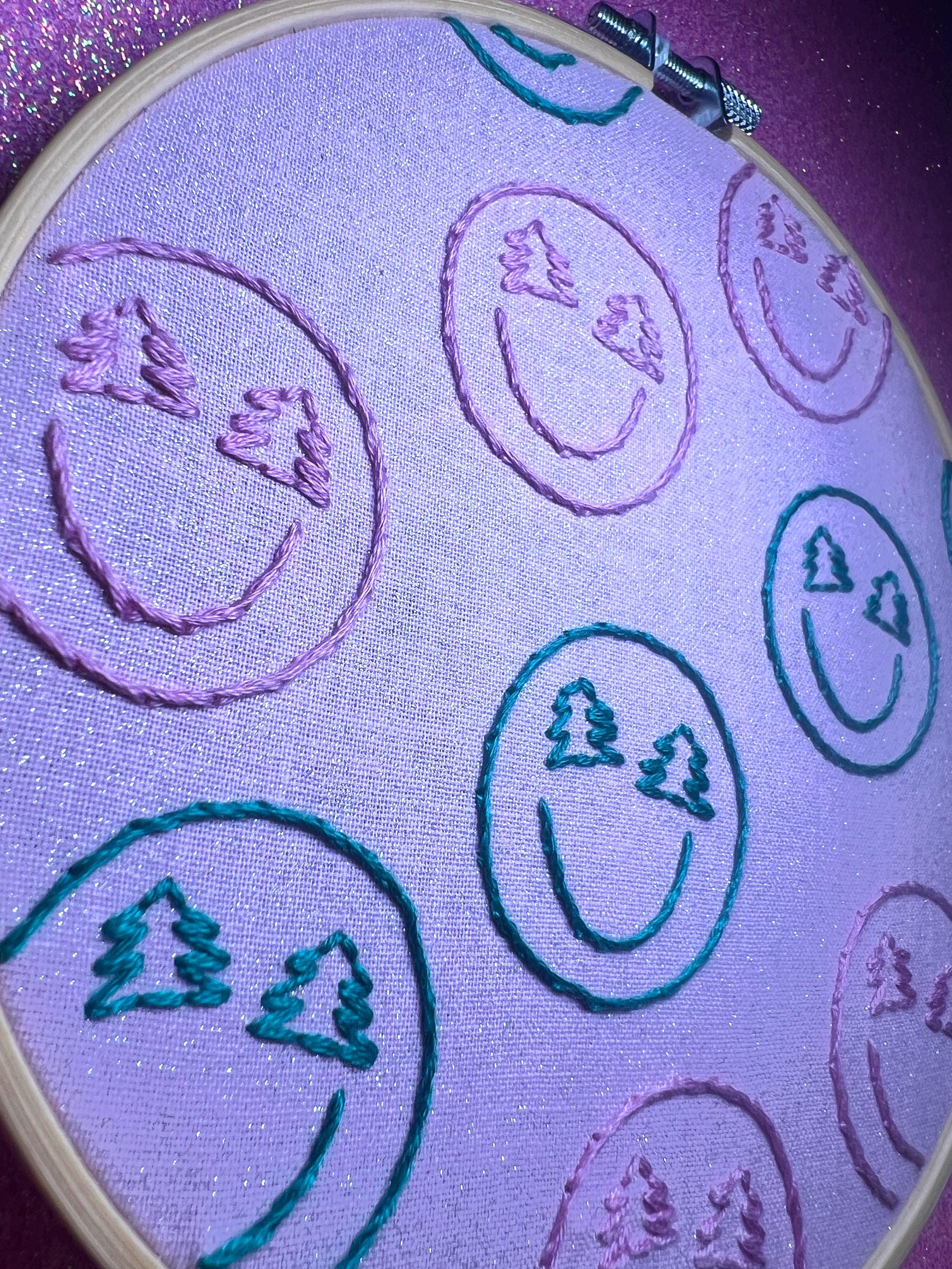 Christmas-y Smiley Faces Finished Embroidery Hoop on Pink Fabric