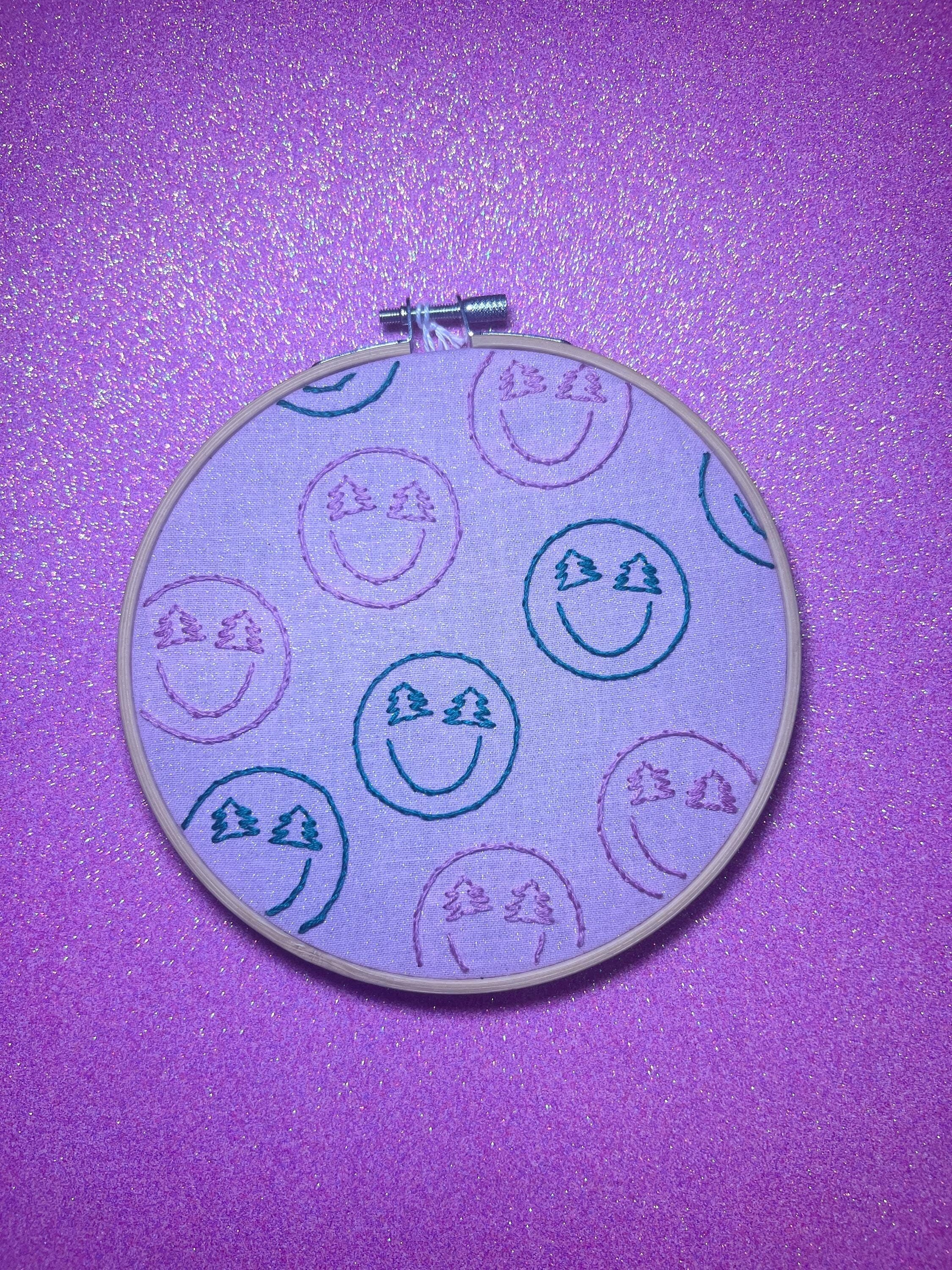 Christmas-y Smiley Faces Finished Embroidery Hoop on Pink Fabric